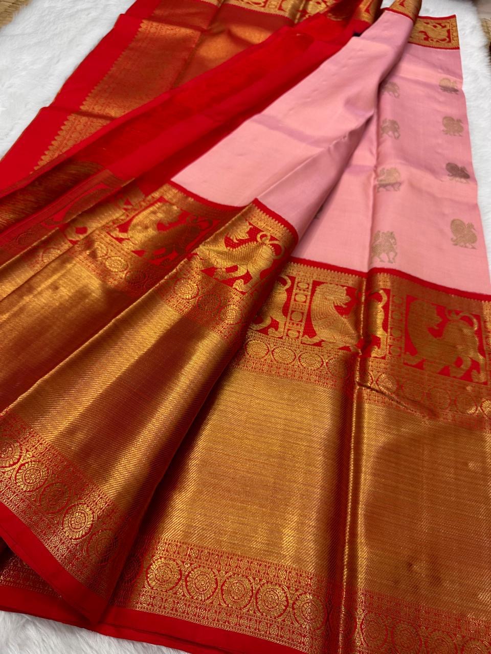 Stuthi ✨ — Vermilion Red Pure Kanchipuram Silk Saree
With Traditional Korvai Weave & Broad Yaali Border
Adorned in Intricate Chakram Motifs & Fine 3G Zari, Grand Zari Brocade Pallu with Medallion Artistry
Contrast red blouse with a broad border