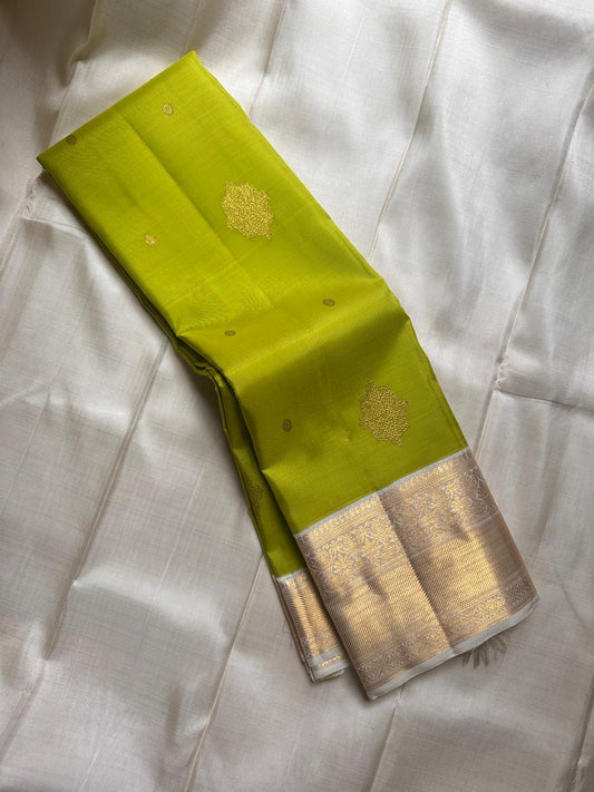 Fresh green pure silk Kanchipuram with cream floral butta