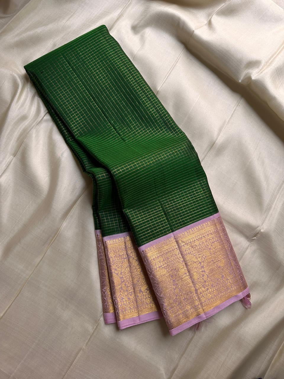 Vibrant green Zari kattam with pastel pink border peacock motif and Pallu