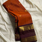 🧡 

Swarnamala — Korvai Kanchipuram Pure Silk

Rust-orange body with radiant gold chakram buttas

Deep purple korvai borders with rich zari detailing

Striped zari brocade pallu with temple-inspired motifs

Silk Mark Certified • Free Shipping within USA