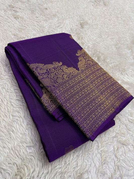 Lotus Glow — Violet | Pure Kanchipuram Silk Saree
A royal violet canvas with antique-gold zari peacocks, elephants & lotus motifs ✨
Silk Mark Certified • Free USA Shipping • Ships in Two Weeks