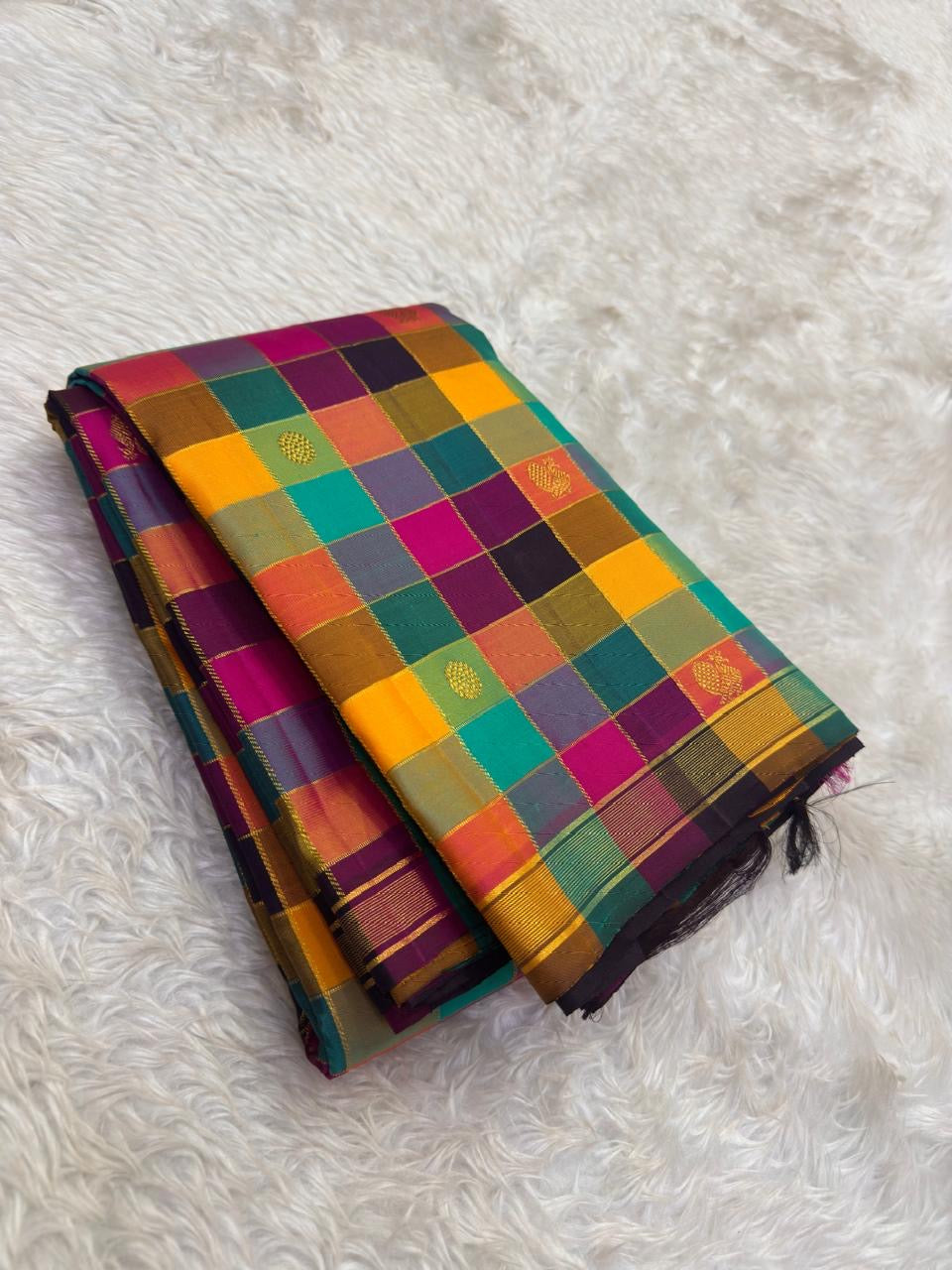 Pure silk Kanchivaram saree with jewel-tone colour blocks and zari border detailing