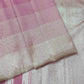 Close-up of a pink and beige fabric with a subtle pattern