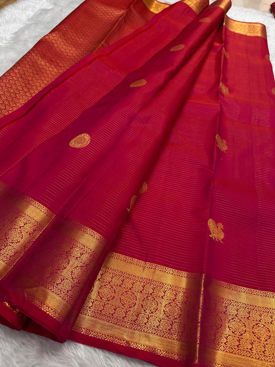 South Indian Kanchipuram silk saree with peacock butta motifs and gold zari weaving