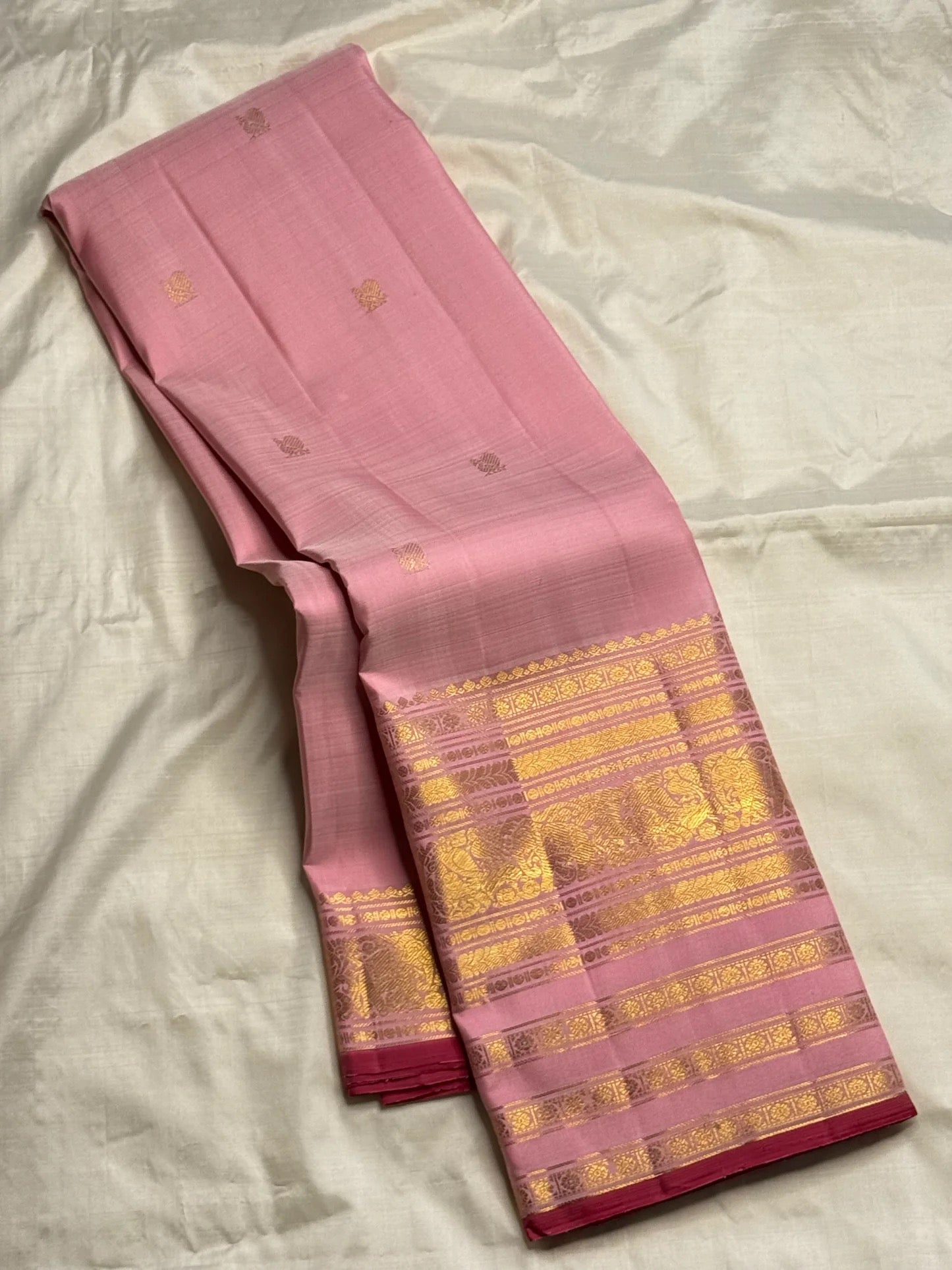 Handwoven blush pink Varisaipet Kanchipuram silk saree with gold zari border, front view