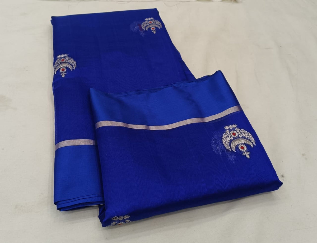 Royal Blue handloom Pattu Silk Chanderi saree displayed with silver motifs, red accents and fine striped pallu