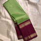Samprada – Kanchipuram Silk Saree in vibrant cardamom Green & brown
A vibrant parrot green body meets a rich maroon border in this timeless Kanchipuram silk saree