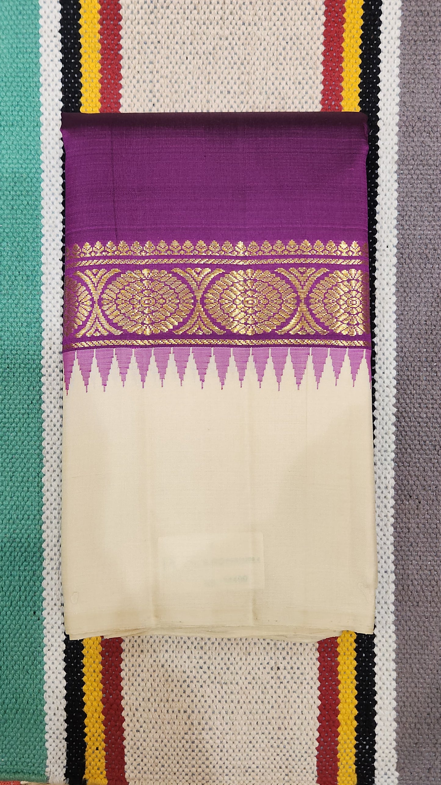 Ivory Plum ✨ – Pure Kanchipuram Silk Saree
Ivory Silk Body with Smooth Finish
Plum-Purple Contrast Border with Gold Zari Motifs
Temple-Inspired Edging & Rich Plum Pallu

Silk Mark Certified, delivery in 2 weeks