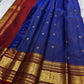 Royal blue zari kattam body with delicate buttas on a Kanchipuram saree