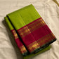 Maavilai Arakku Chakram — Korvai Kanchipuram Pure Silk

Parrot-green vaira-oosi body with soft pin-stripe sheen

Contrast arakku/rani border with gold chakram medallions & temple motifs

Arakku pallu with all-over coin-jaal; contrast blouse included