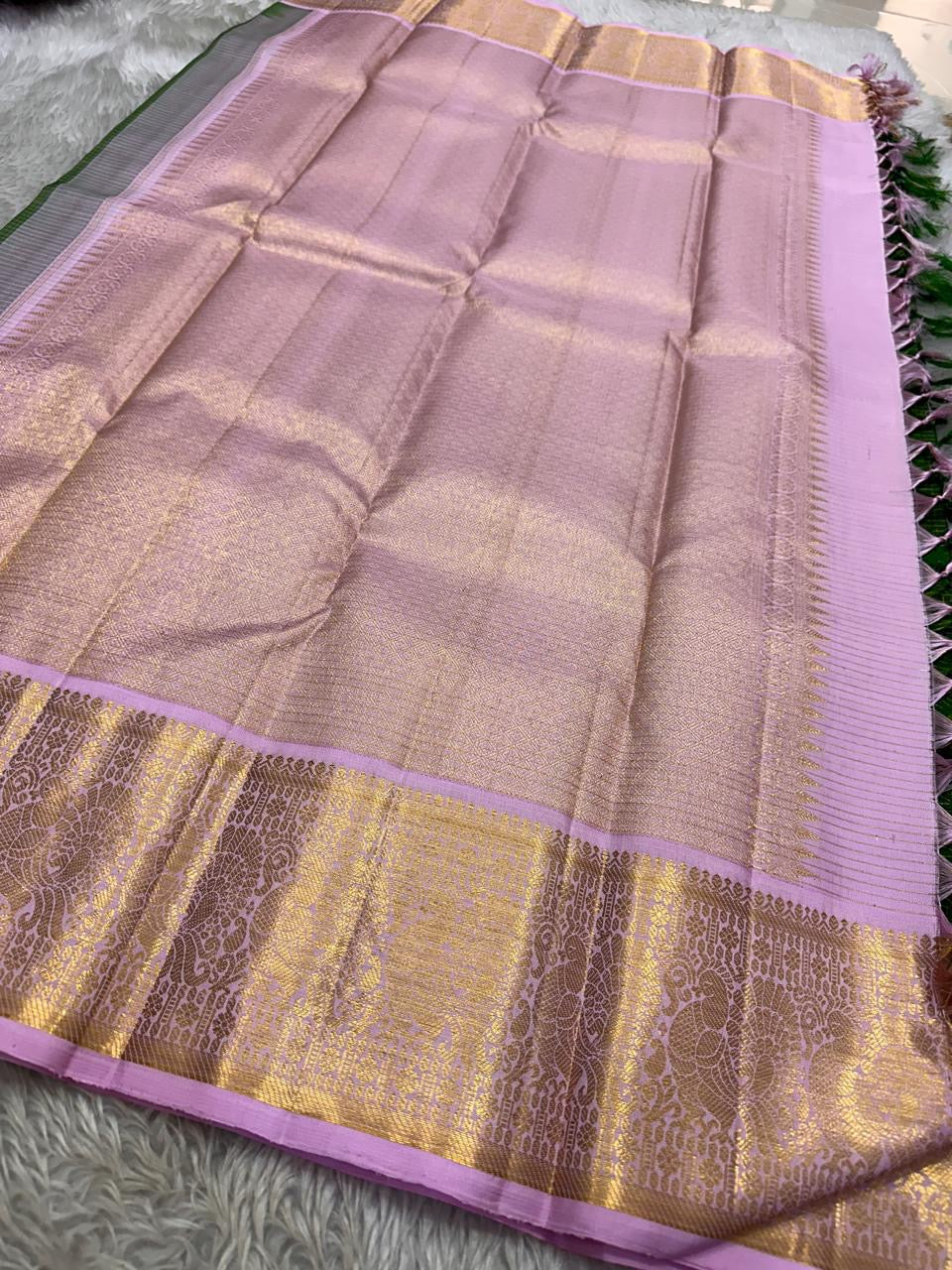 Vibrant green Zari kattam with pastel pink border peacock motif and Pallu