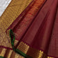 Arakku Gandaberunda vairaoosi — Pure Silk Kanchipuram Saree
Deep arakku  in fine vaira oosi weave with gold Gandaberunda motifs 🦅
Antique-gold temple borders & emerald-green selvedge • Silk Mark Certified • Free USA Shipping • Ships in Two Weeks ✅