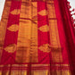 Ravi Kiranam — Sona Roopa Kattam Kanchipuram Pure Silk

Vibrant festive red body with allover kattam (grid) checks

Gold & silver sona-roopa zari alternating for a soft shimmer

Grand kaddi border with rich zari paisley vines & floral tracery

Silk Mark