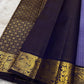 Classic heritage finesse in this lilac blue pure Kanchipuram silk saree Zari kattam , intricately handwoven with fine golden checks across the body. Scattered floral buttas add delicate charm,rich purple peacock border