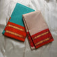 Sharvani blue sea green – sea green  Checked Silk Saree with an Orange red  shot color Zari Border & Vibrant Pallu A timeless silk saree featuring a cream body with delicate red checks, complemented by a striking churan orange  zari border pallu.