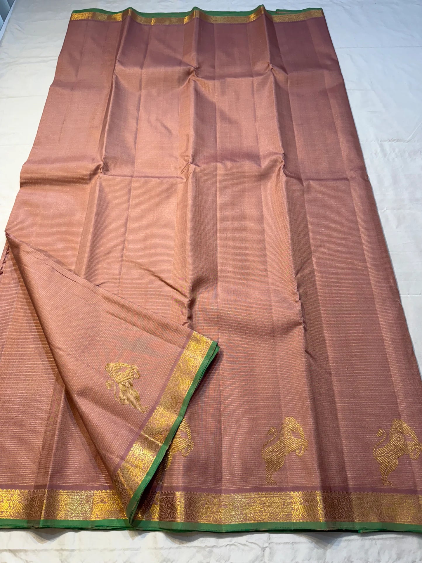 Tamra Yazhi — Pure Kanchipuram Silk vairaoosi with Antique Gold zari  Yazhi Motifs
green-edged traditional brocade border
Silk Mark Certified • Free Shipping within USA • Ships in Two Weeks