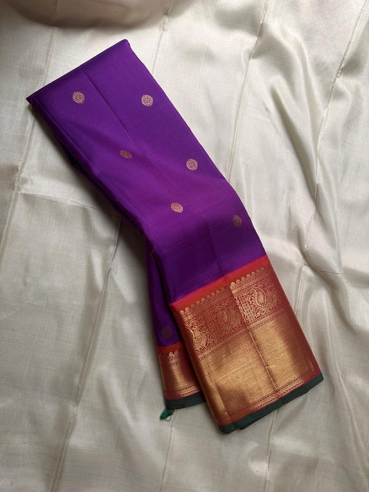 Mayuri -Purple Coral Pure Silk Kanchipuram Saree with Kamalam Buttas, Red-Orange Mayil Border & Exquisite Vanasringaram Zari Pallu