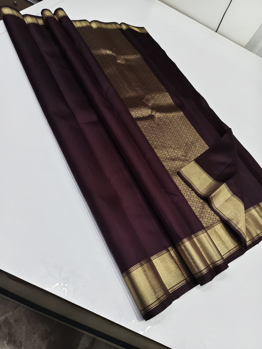 The most exuberant brown in a soft  silk saree, zari border and detailed pallu