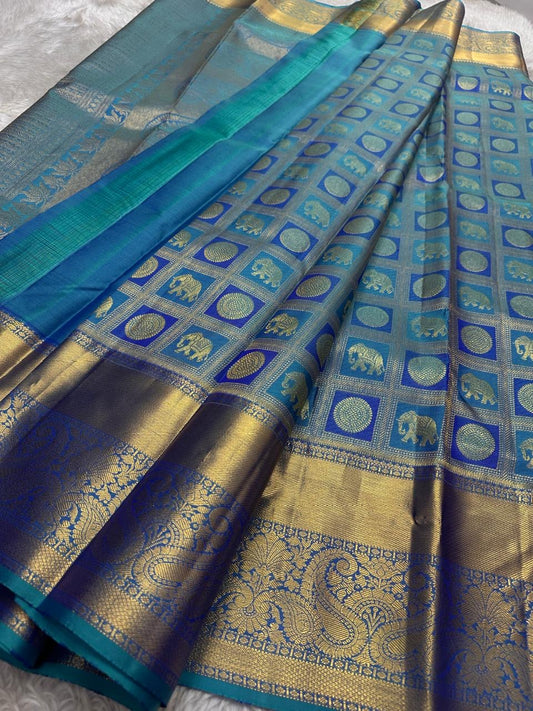 Pure silk KanchiPuram peacock blue with a shot of green elephant and Kamalam Zari checks saree