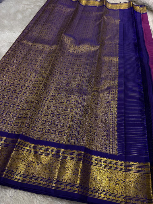 Vairaoosi deep pink with zari lines all over and a deep purple border with Rudhraksha pettu vanasringaram and chakram butta Pallu