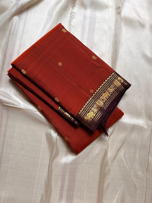 Varnam – Rust Brown Kanchipuram Silk Saree with Yazhi & Kamalam Buttas, Petite Elephant Zari Border & Intricately Woven Grid Pallu | Pure Handloom Heritage