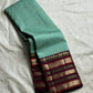 Teal Mint Muthu Kattam — Pure Silk Kanchipuram Saree
Teal-mint body with tiny  zari  buttas & plum-maroon korvai borders
Silk Mark Certified • Free USA Shipping • Ships in Two Weeks