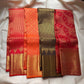 Sunset orange vermillion pure silk Kancheepuram saree, folded view