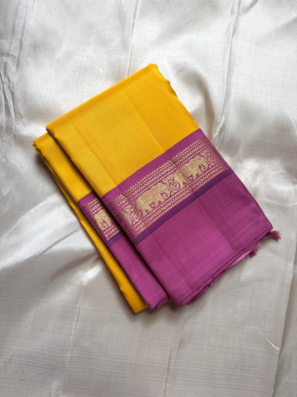 Yellow pure  Kanchipuram Silk Saree with Kaal Erangina pink Zari Border