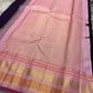 Shyamala—named after the deep, dark shade it embodies 💜 A pure Kanchipuram silk masterpiece with a rich purple body sprinkled with golden zari buttas. The contrast pink border glows with floral and paisley zari motifs, accented in coral and rose-gold, wh
