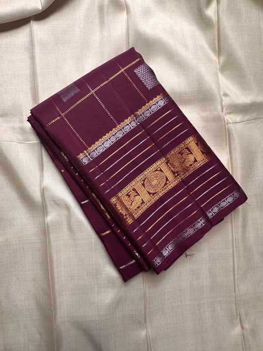 Pankajam 🌺 — a brown-purple jamun Kanchipuram silk saree woven with silver & gold zari kattam, delicate kolam motifs, and a deep magenta-purple selvedge. The Sona Roopa pallu shimmers with ornate grids and intricate motif