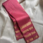 vasantham  pink – Handwoven Kanchipuram Silk Saree
A poem in pink silk. The body glows in a serene rose pink, softly accented by delicate gold vertical lines and dainty gold zari buttas that glint like little blessings.