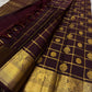 Ambaram – Coffee Brown

 — Pure Kanchipuram Silk

Elephant & Peacock Procession Zari Border • Coin & Gandaberunda Buttas

Geometric Diamond Brocade Pallu in Antique Gold

Handloom •

Silk Mark Certified • Ships in Two Weeks