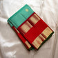 Poomugam Pachai
Pure Silk in Tender Mint & Kumkum Red
Zari-Woven Grandeur in korvai  Contrast