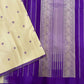 Paal Vadamalli Chakram – Pure Kanchipuram Silk Saree

Ivory body with royal-purple floral coin thread buttas

Grand purple pallu with zari panels & striped center

Handloom Double Warp Weave | Silk Mark Certified | Fall & Pico Done

Free shipping