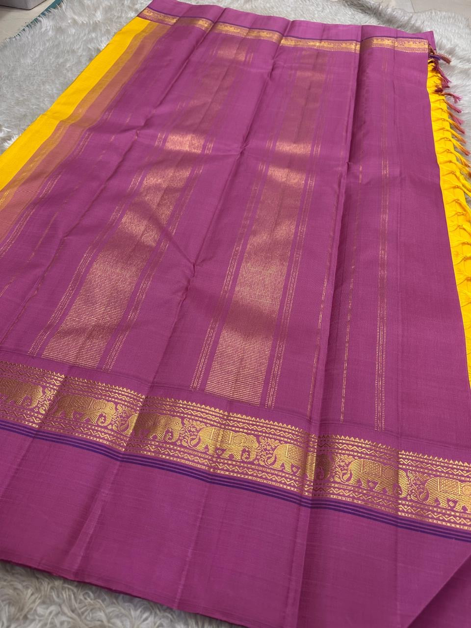 Yellow pure  Kanchipuram Silk Saree with Kaal Erangina pink Zari Border