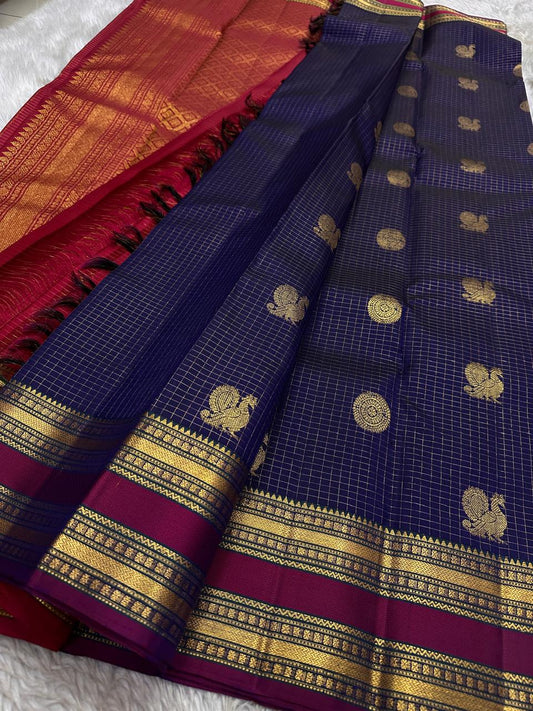 Peacock Constellation Kattam
Midnight Navy Kanchipuram Silk Saree
Gold Zari Grid with Mandala & Peacock Buttas