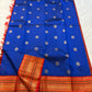 Royal blue Kanchipuram silk saree full view with coin buttas and contrast red zari border