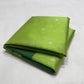 Folded Parrot Green Chanderi saree showing the silver floral buttas and forest green border