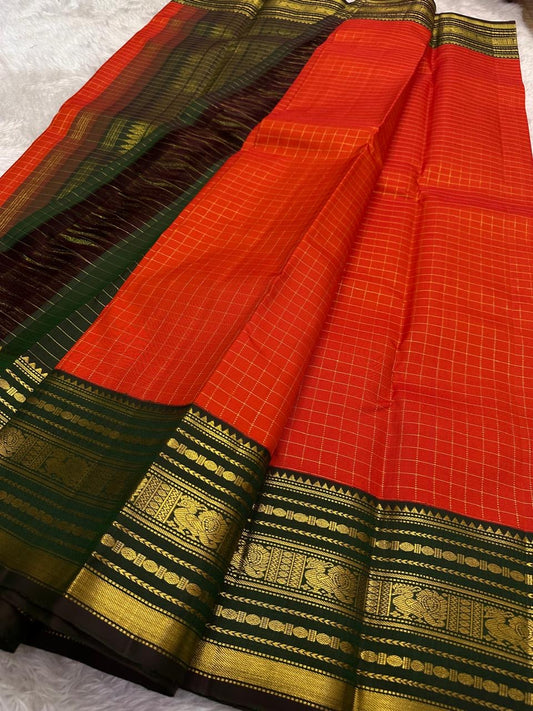 Handwoven Kanjeevaram Varisaipet saree featuring vibrant red body and deep forest green border