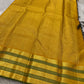 Adar Manjal Chakram – Pure Kanchipuram Silk Saree
Deep green  & Manjal-Gold Zari Korvai Borders 
Chakram & Floral Zari Motifs, Grand Manjal Brocade Pallu
Silk Mark | Fall & Pico Done | Blouse Stitching Available | ships in  2 weeks