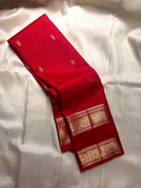 Soma - Drenched in the richness of crimson , woven with pride - Gandaberunda motifs all over body rettapettu border with vanasringaram motifs