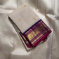 ⸻

Ivory Glow ✨ – Pure Kanchipuram Silk Saree in Ivory

Korvai Royal-Purple Border with Elephant & Peacock Zari Panels; Magenta Selvedge
Body with Gold Coin & Paisley Buttas
Grand Royal-Purple Brocade Zari Pallu with Hand-knotted Tassels