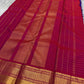 Amethyst Zari Kattam – Pure Kanchipuram Silk Saree
Rich Amethyst Purple Body with Golden Zari Checks
Broad Gold Zari Border with Red Highlights & Temple Motifs
Radiant Ruby Red-Orange Pallu with Lustrous Zari Stripes

Silk Mark Certified, delivery in 2 we
