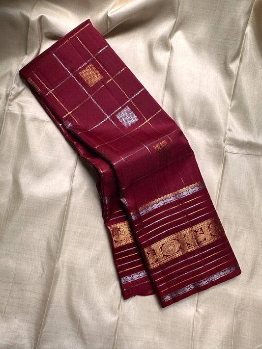 Pankajam 🌺 – Brown maroon Kanchipuram Silk Saree with Zari Kattam, Dashed Lines, Kolam Motifs, Varisaipet Border with Thandavalam Zari Stripes, Rudrakshpet, Annam & Kamalam Motifs, Deep Brown Selvedge & Ornate Pallu