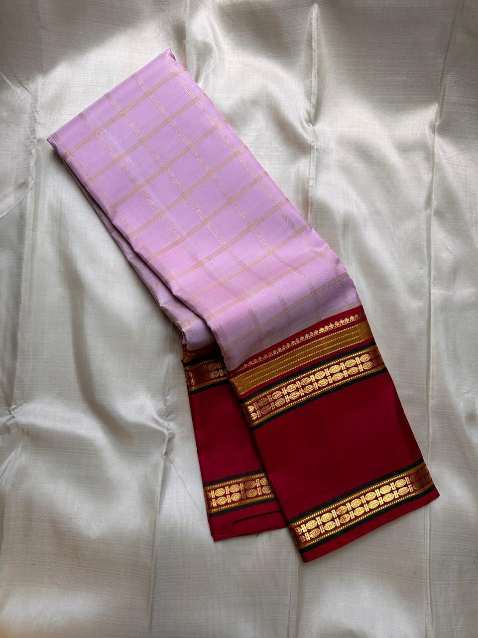 Pastel Pink Zari Kattam
Blush-pink  Kanchipuram Silk Saree
Contrast Maroon Borders in Gold Zari