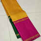 Suvarna Kattam ✨ – Pure Kanchipuram Silk Saree
Golden Mustard Body with Intricate Kattam Checks
Vibrant Magenta Pink Border with Zari Detailing
Emerald Green Selvedge Adding Striking Contrast

Silk Mark Certified, delivery in 2 weeks