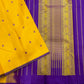 Manjal Vadamalli Chakram – Pure Kanchipuram Silk Saree

Marigold yellow body with purple floral thread buttas

Grand royal purple pallu with gold medallion zari & reku-style stripes

Handwoven Double Warp Weave | Silk Mark Certified | Fall & Pico Done