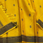 Marigold – Pure Kanchipuram Silk Saree
Haldi yellow body with charcoal paisley buttas
Contrast charcoal border in silk thread, floral vine
Silk Mark Certified | Blouse Piece Included | Fall & Pico Done
Free Shipping within USA | Ships in 2 Weeks