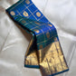 Nemali Zari Checks | Pure Silk Kanchipuram


Peacock-Blue & Emerald-Green Dual Tone • Zari Checks with Buttas

Gold Zari Borders with Paisley Motifs • Rich Brocade Pallu

Silk Mark Certified • Free Shipping within USA

Ships in Two Weeks | Blouse Sti