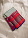 Pastel green pistachio with kungumam red and royal blue border dark blue silk thread checks mayil chakram butta magenta detailed Pallu
